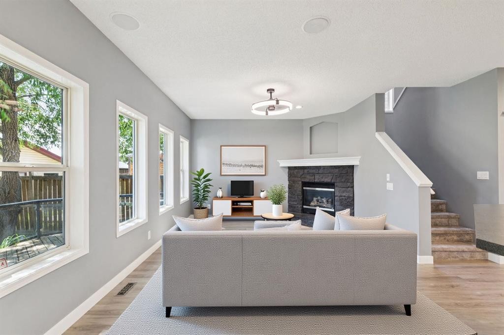 137 Prestwick Mews Se, Calgary, AB - Indoor Photo Showing Living Room With Fireplace