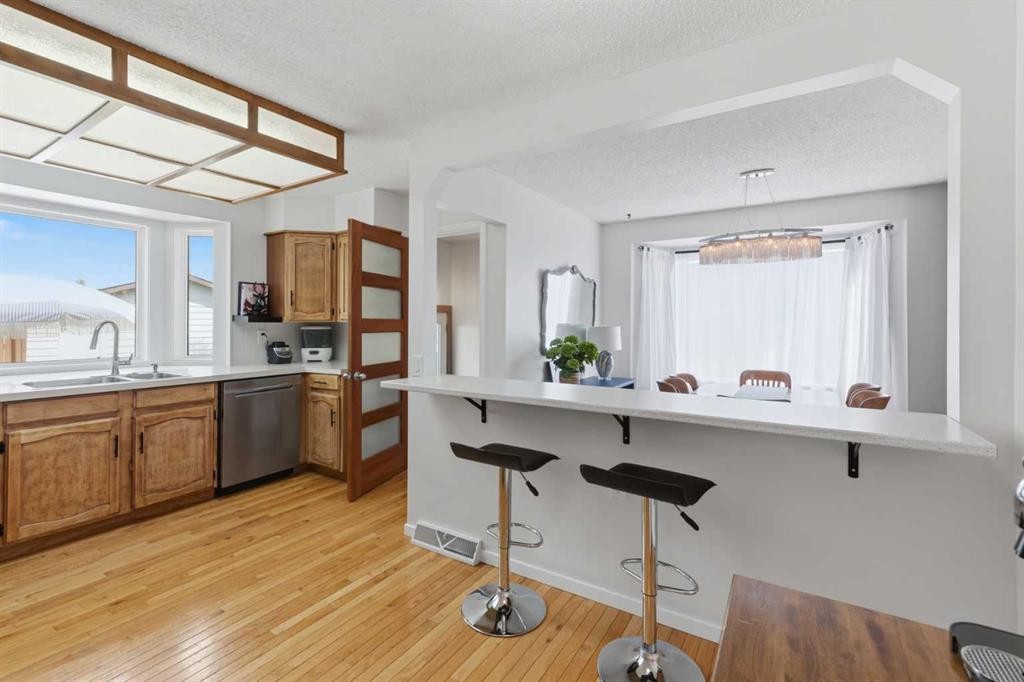 331 Queensland Circle Se, Calgary, AB - Indoor Photo Showing Kitchen With Double Sink