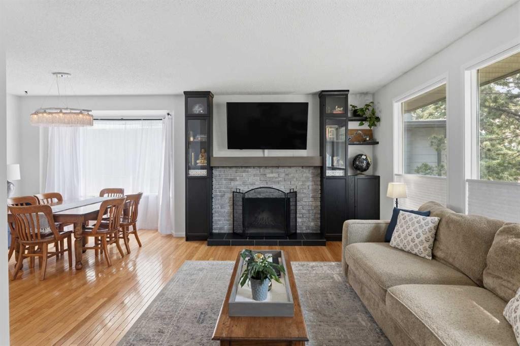 331 Queensland Circle Se, Calgary, AB - Indoor Photo Showing Living Room With Fireplace
