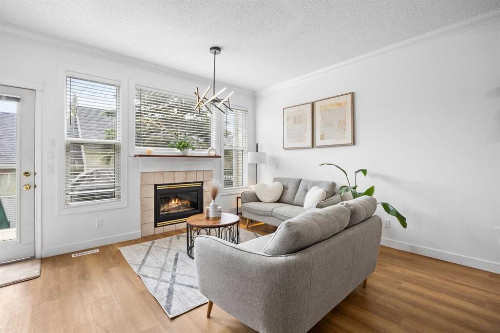 59 Prestwick Park Se, Calgary, AB - Indoor Photo Showing Living Room With Fireplace