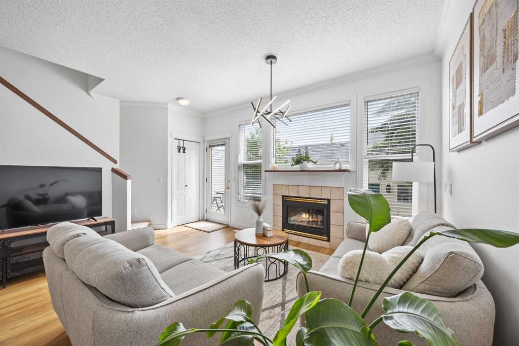 59 Prestwick Park Se, Calgary, AB - Indoor Photo Showing Living Room With Fireplace