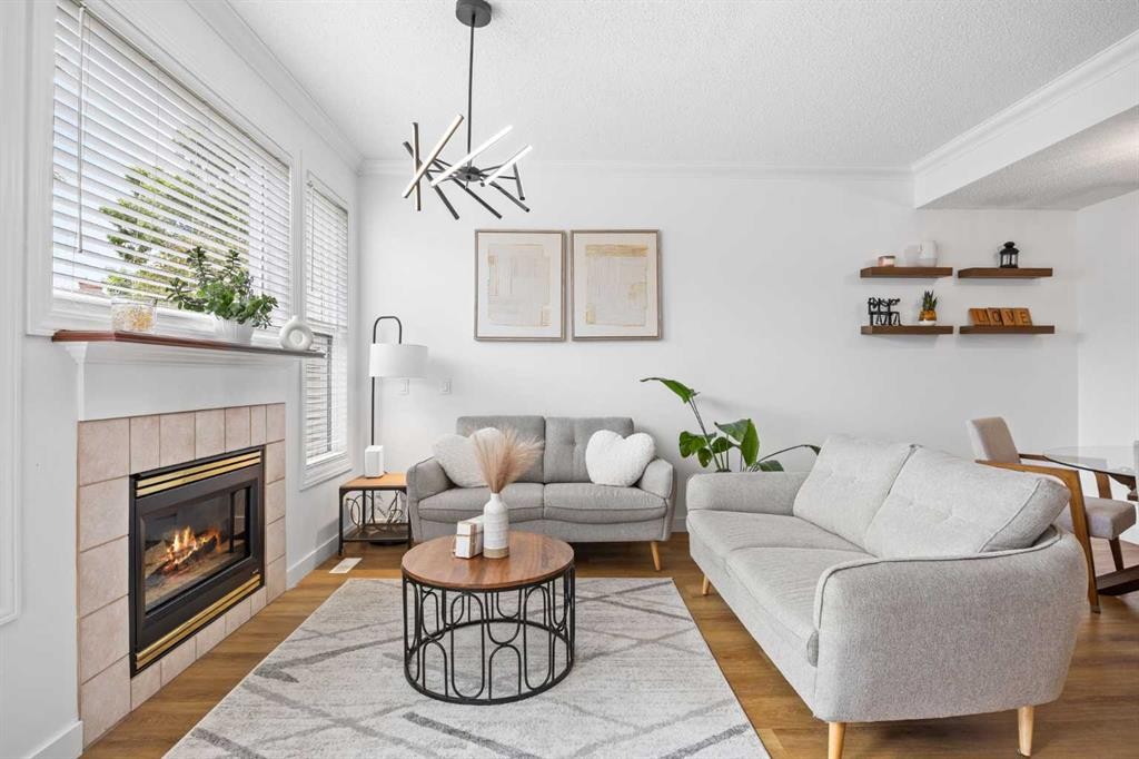 59 Prestwick Park Se, Calgary, AB - Indoor Photo Showing Living Room With Fireplace