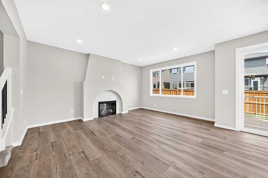 48 Creekside Path Sw, Calgary, AB - Indoor Photo Showing Living Room With Fireplace
