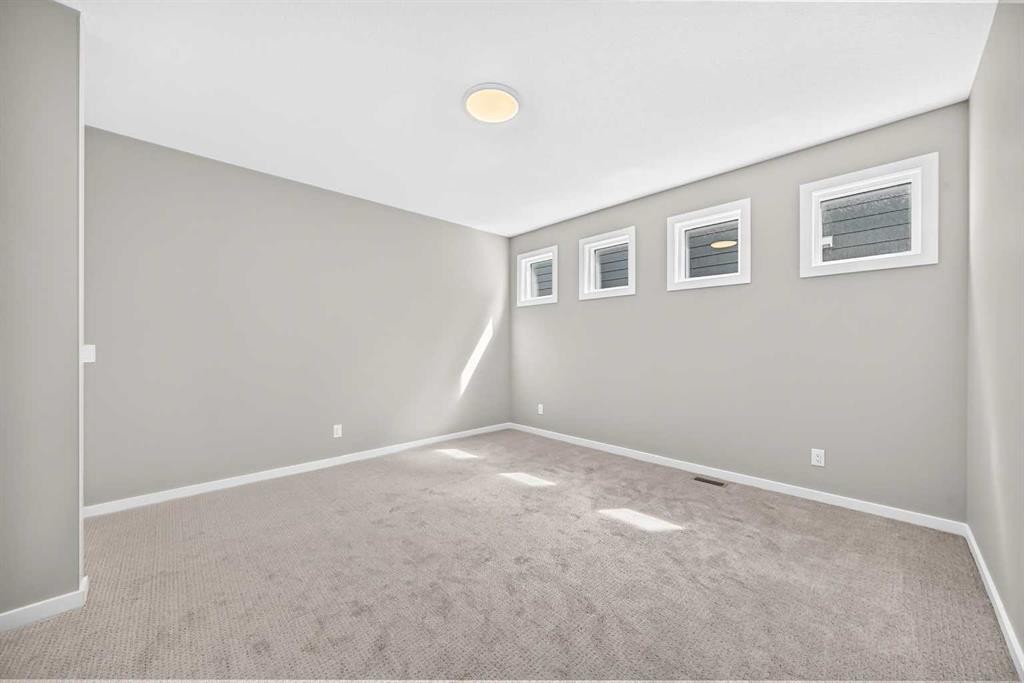 48 Creekside Path Sw, Calgary, AB - Indoor Photo Showing Other Room