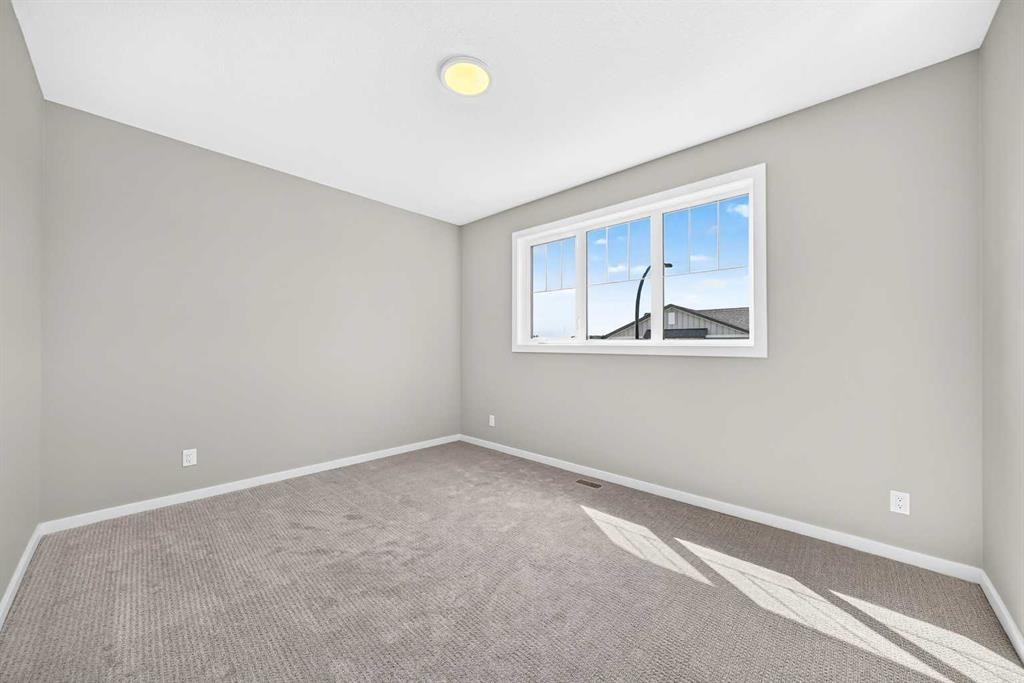 48 Creekside Path Sw, Calgary, AB - Indoor Photo Showing Other Room