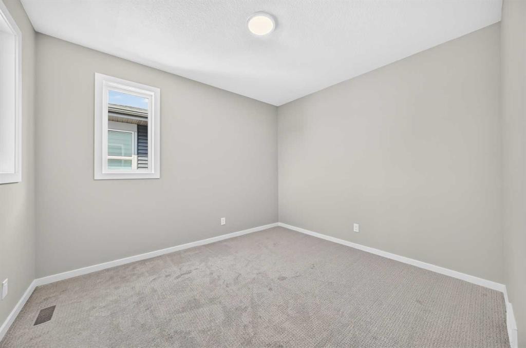 48 Creekside Path Sw, Calgary, AB - Indoor Photo Showing Other Room