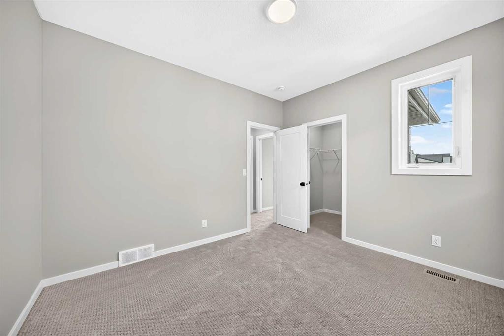 48 Creekside Path Sw, Calgary, AB - Indoor Photo Showing Other Room
