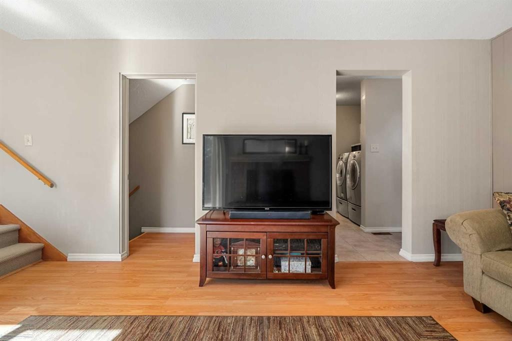 1102 Lake Christina Way Se, Calgary, AB - Indoor Photo Showing Living Room