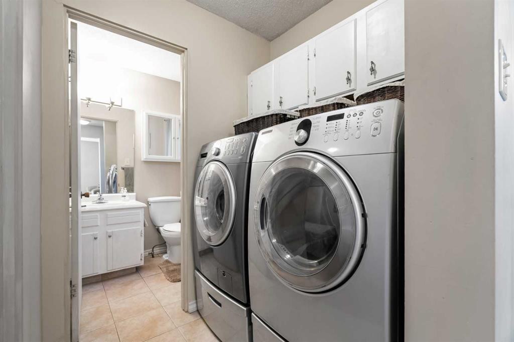 1102 Lake Christina Way Se, Calgary, AB - Indoor Photo Showing Laundry Room