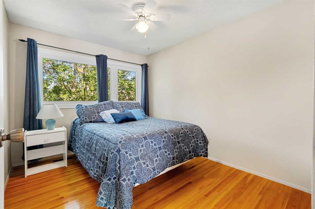 1102 Lake Christina Way Se, Calgary, AB - Indoor Photo Showing Bedroom