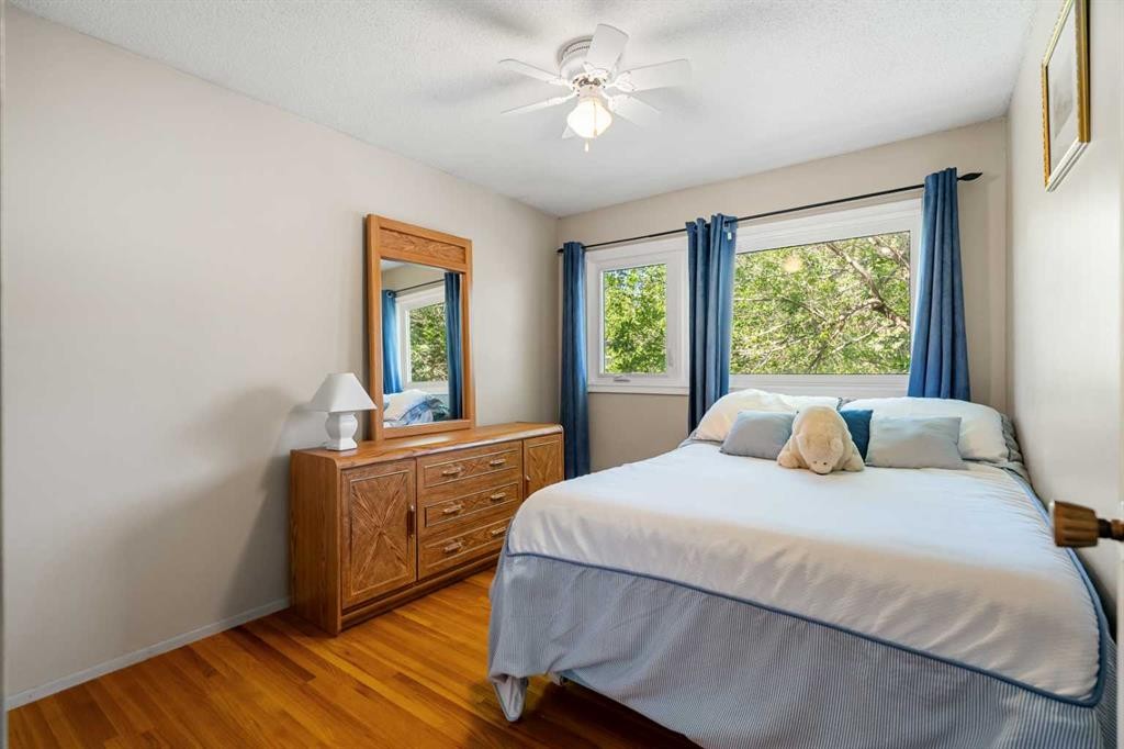 1102 Lake Christina Way Se, Calgary, AB - Indoor Photo Showing Bedroom