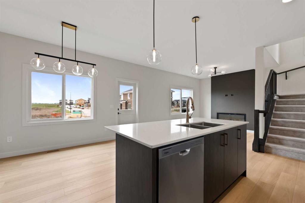 38 Waterford Mews, Chestermere, AB - Indoor Photo Showing Kitchen With Double Sink