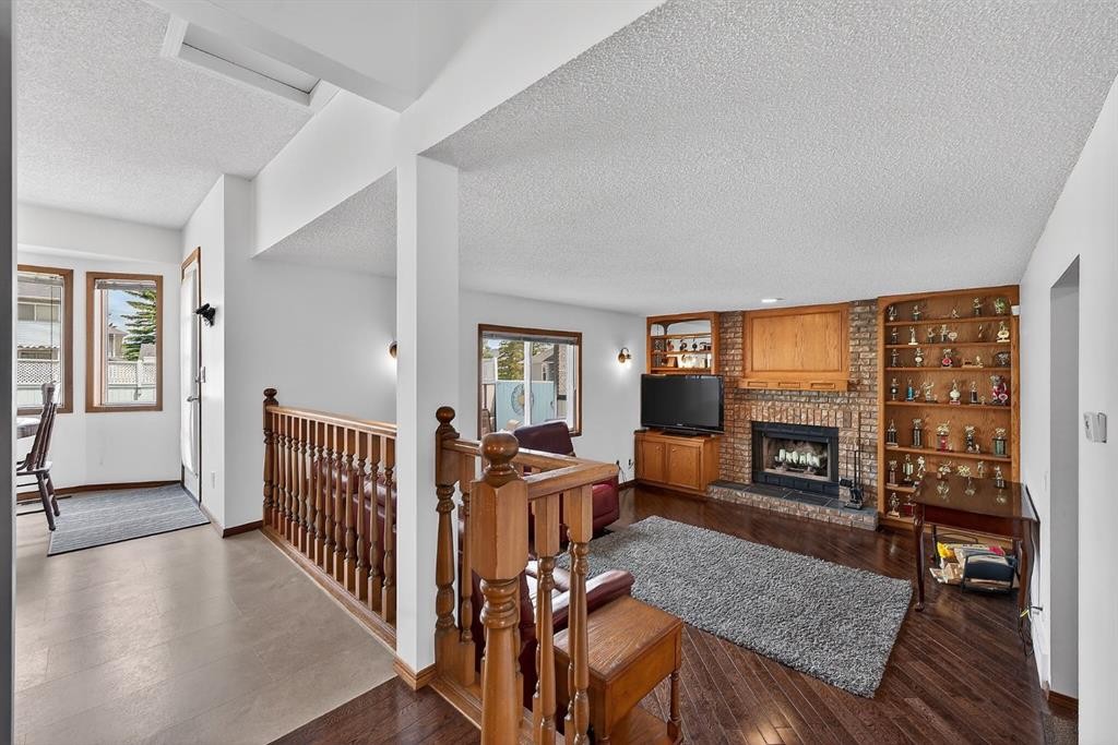 70 Pasadena Gardens Ne, Calgary, AB - Indoor Photo Showing Living Room With Fireplace
