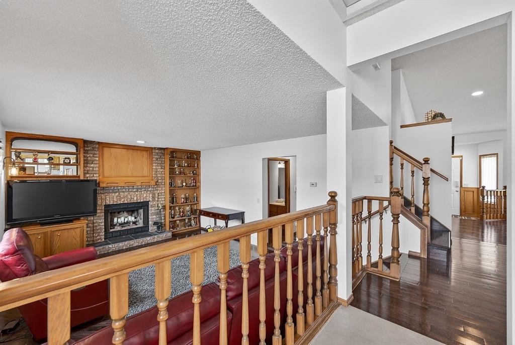 70 Pasadena Gardens Ne, Calgary, AB - Indoor Photo Showing Other Room With Fireplace