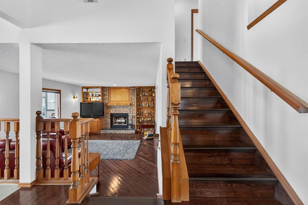 70 Pasadena Gardens Ne, Calgary, AB - Indoor Photo Showing Other Room With Fireplace