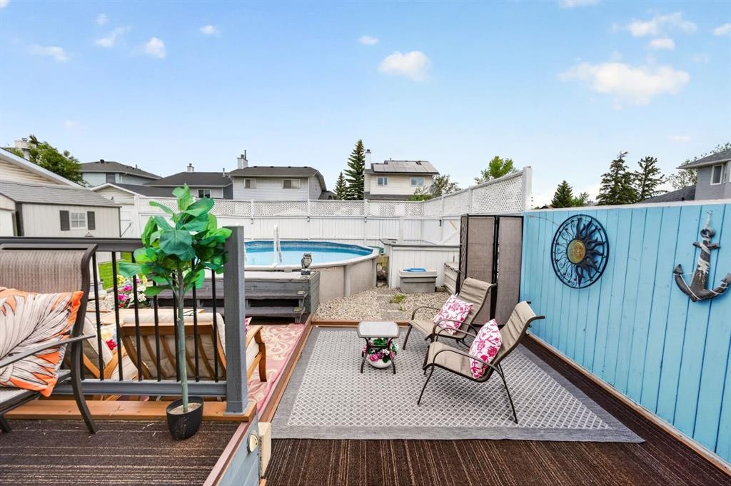 70 Pasadena Gardens Ne, Calgary, AB - Outdoor With Above Ground Pool With Deck Patio Veranda