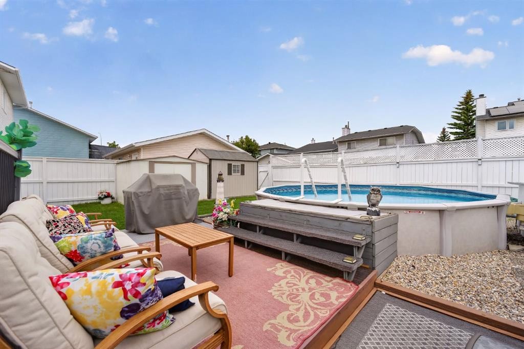 70 Pasadena Gardens Ne, Calgary, AB - Outdoor With Above Ground Pool