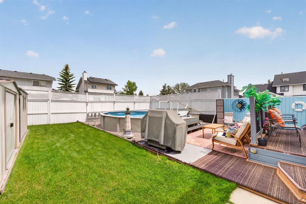 70 Pasadena Gardens Ne, Calgary, AB - Outdoor With Above Ground Pool