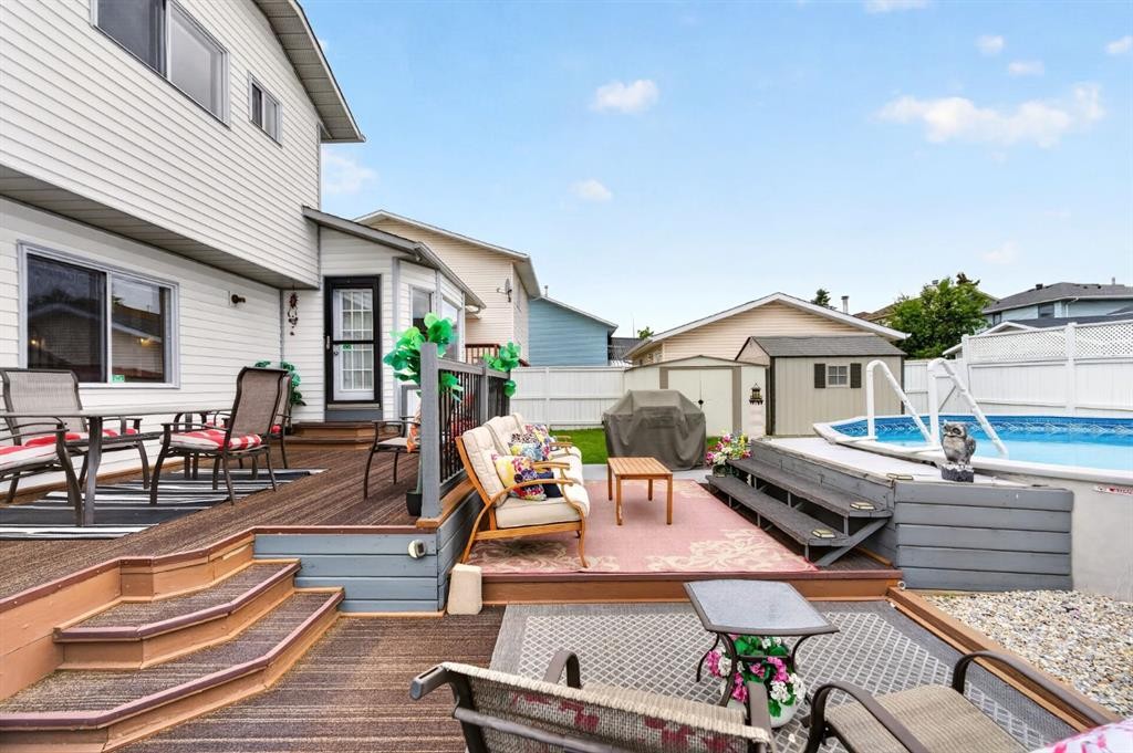 70 Pasadena Gardens Ne, Calgary, AB - Outdoor With Above Ground Pool With Deck Patio Veranda With Exterior