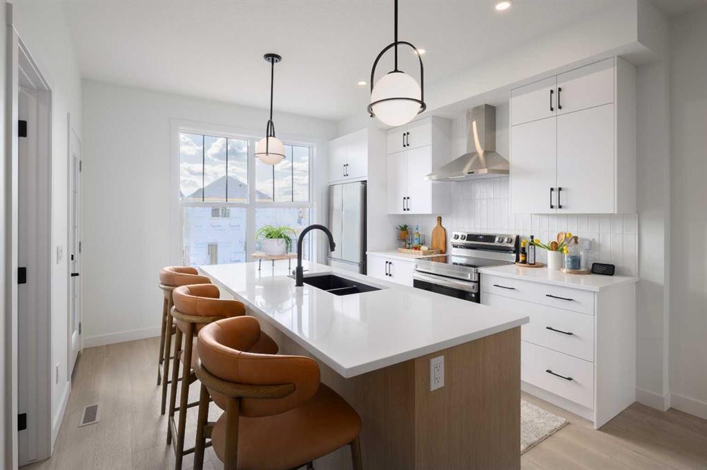 150 Wild Rose Way Se, Calgary, AB - Indoor Photo Showing Kitchen With Double Sink With Upgraded Kitchen