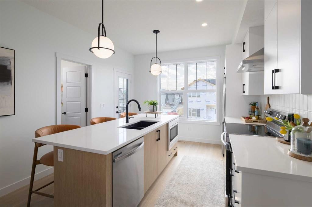 150 Wild Rose Way Se, Calgary, AB - Indoor Photo Showing Kitchen With Double Sink With Upgraded Kitchen