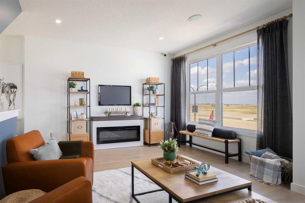150 Wild Rose Way Se, Calgary, AB - Indoor Photo Showing Living Room With Fireplace