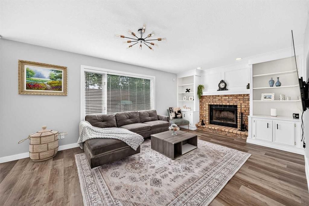 47 Canterbury Court Sw, Calgary, AB - Indoor Photo Showing Living Room With Fireplace