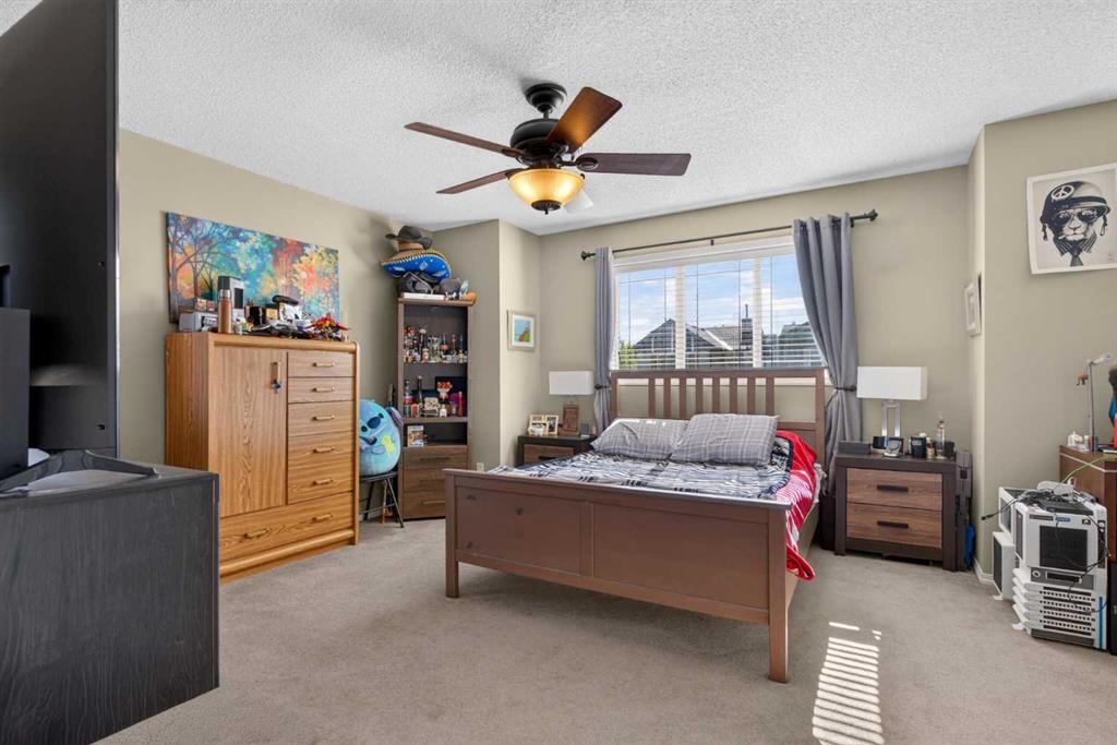 22 Panatella Park Nw, Calgary, AB - Indoor Photo Showing Bedroom