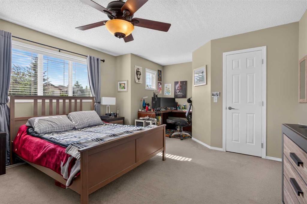 22 Panatella Park Nw, Calgary, AB - Indoor Photo Showing Bedroom