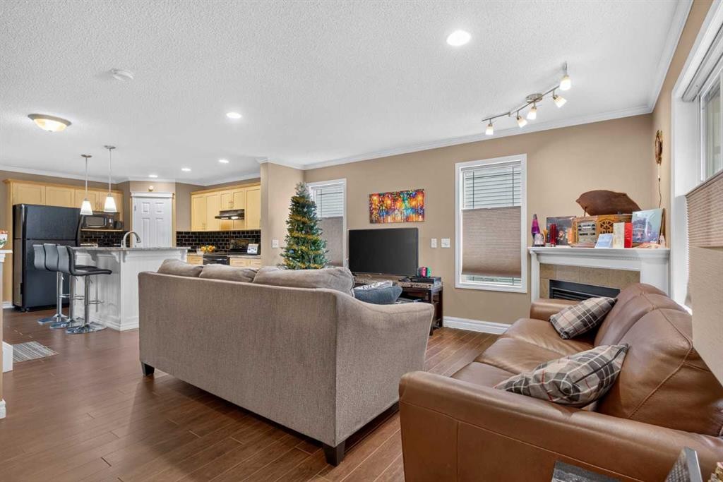 22 Panatella Park Nw, Calgary, AB - Indoor Photo Showing Living Room With Fireplace