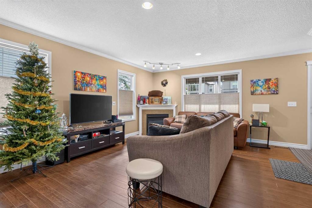 22 Panatella Park Nw, Calgary, AB - Indoor Photo Showing Living Room With Fireplace
