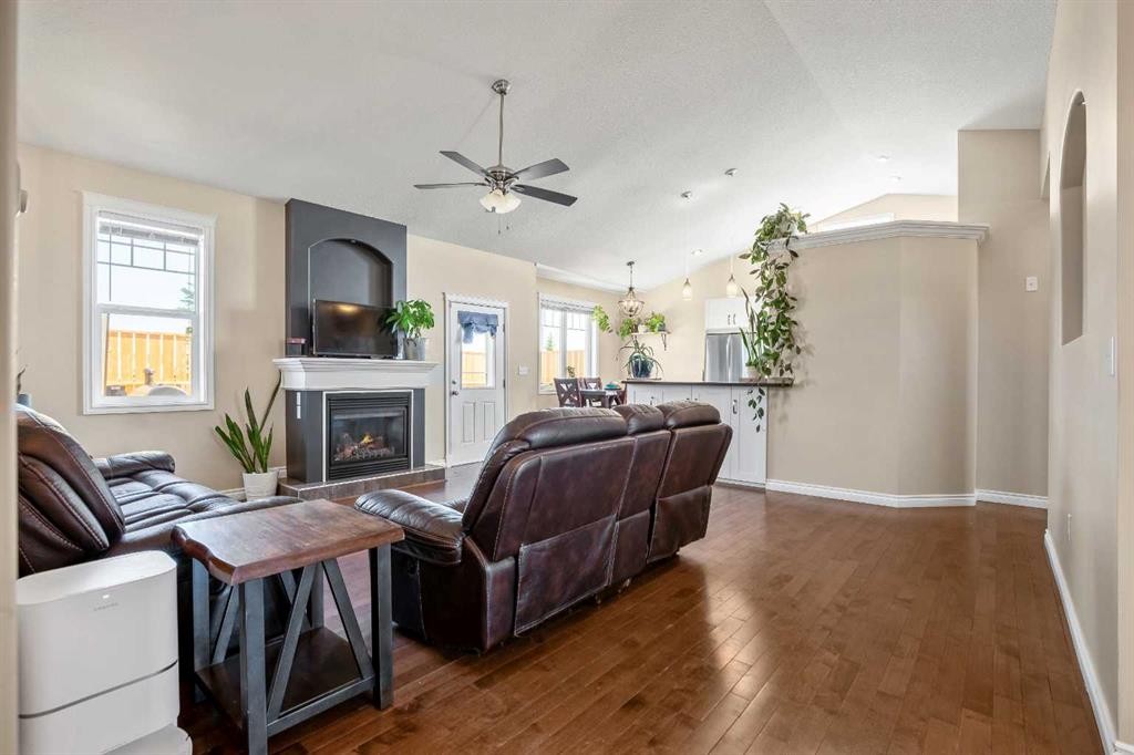 336 Butte Place, Stavely, AB - Indoor Photo Showing Living Room With Fireplace