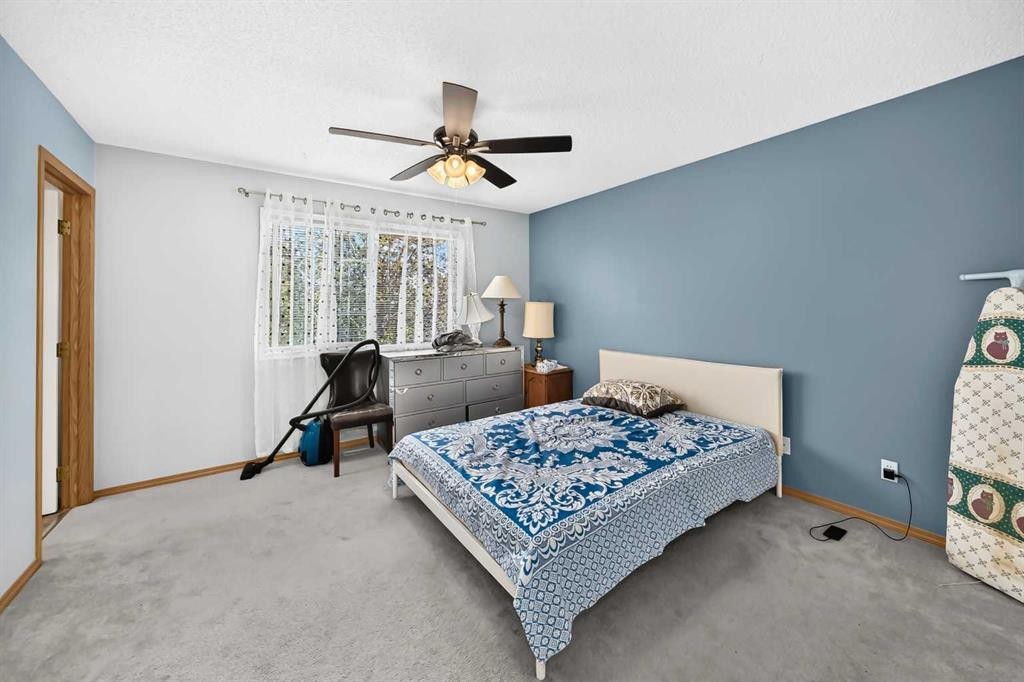 205 Hidden Hills Place Nw, Calgary, AB - Indoor Photo Showing Bedroom