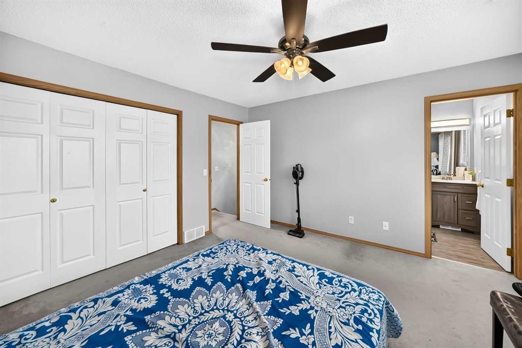 205 Hidden Hills Place Nw, Calgary, AB - Indoor Photo Showing Bedroom
