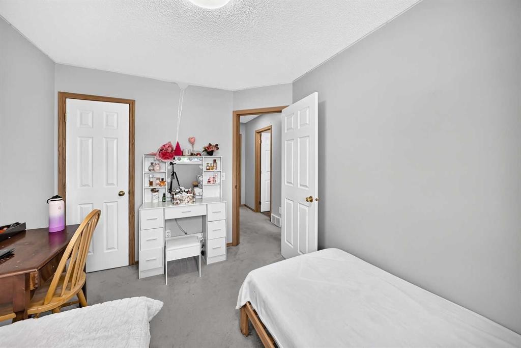 205 Hidden Hills Place Nw, Calgary, AB - Indoor Photo Showing Bedroom