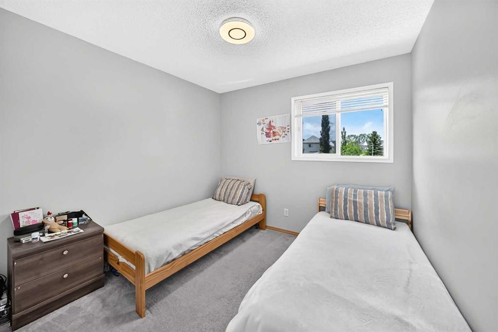 205 Hidden Hills Place Nw, Calgary, AB - Indoor Photo Showing Bedroom
