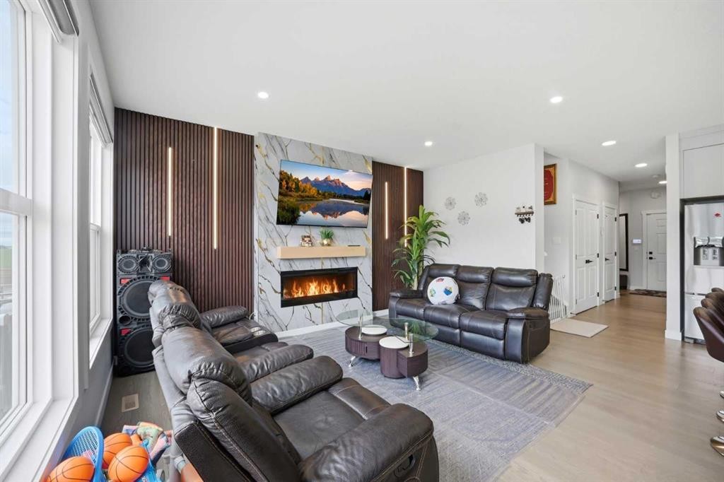 241 Homestead Crescent Ne, Calgary, AB - Indoor Photo Showing Living Room With Fireplace