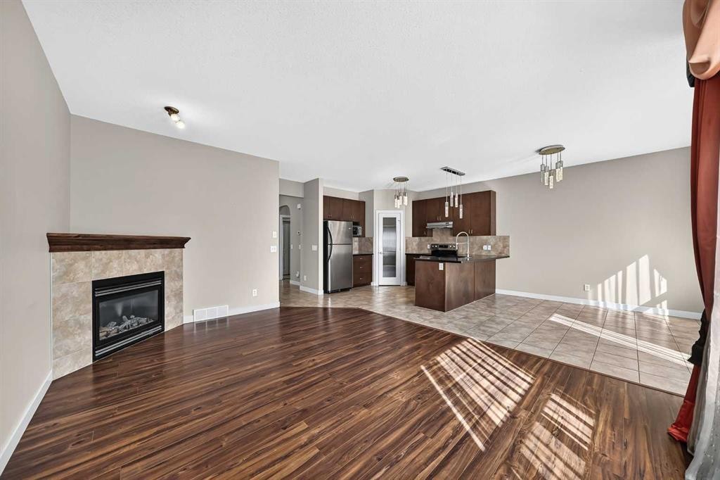 38 Everwoods Link Sw, Calgary, AB - Indoor Photo Showing Living Room With Fireplace
