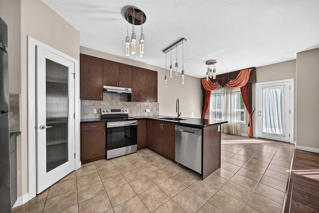 38 Everwoods Link Sw, Calgary, AB - Indoor Photo Showing Kitchen With Stainless Steel Kitchen