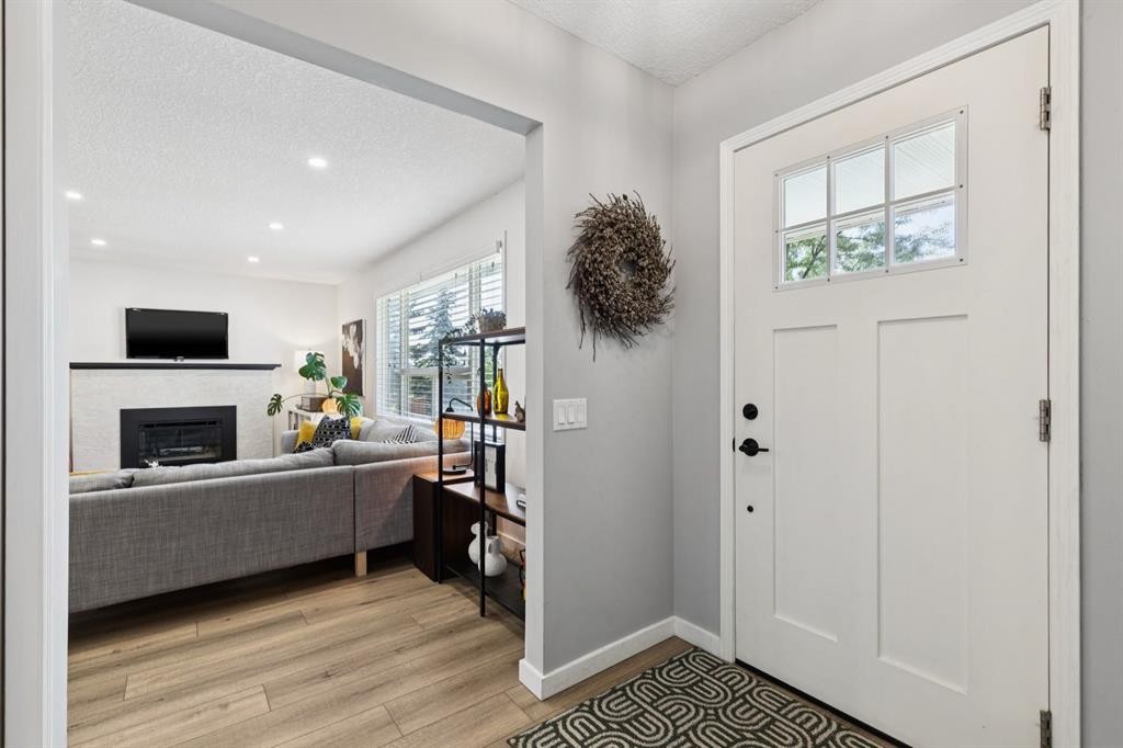 716 Cantree Road Sw, Calgary, AB - Indoor With Fireplace