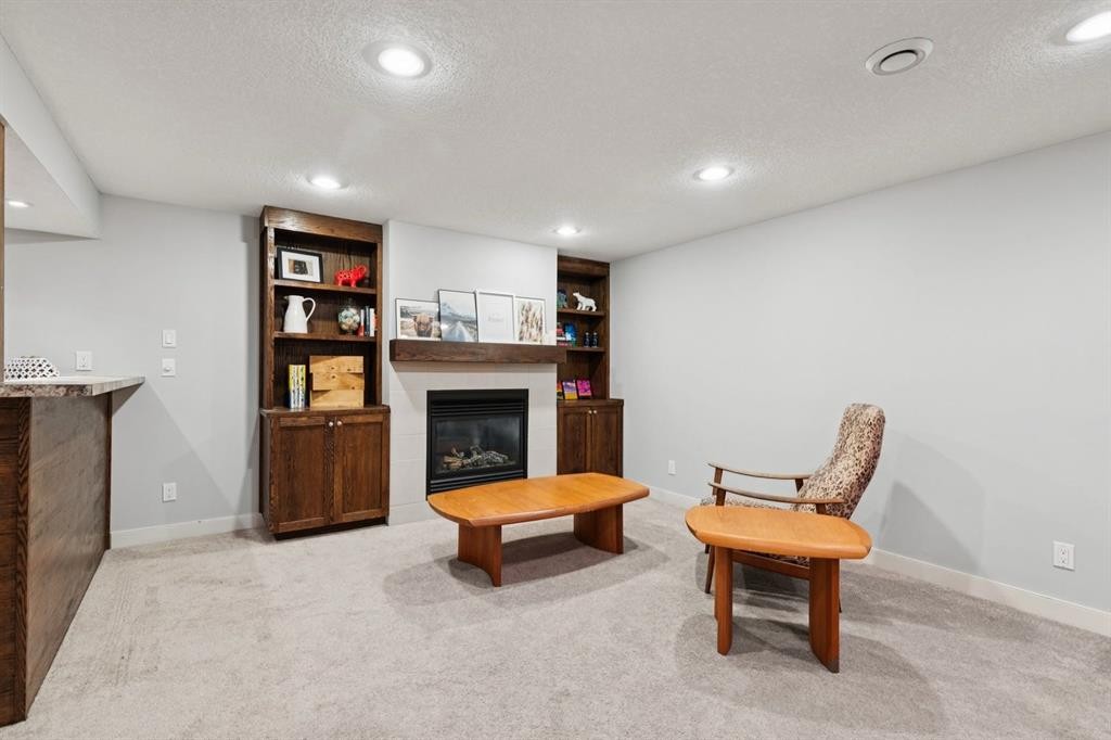 716 Cantree Road Sw, Calgary, AB - Indoor With Fireplace