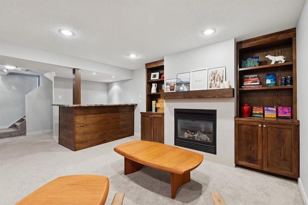 716 Cantree Road Sw, Calgary, AB - Indoor With Fireplace