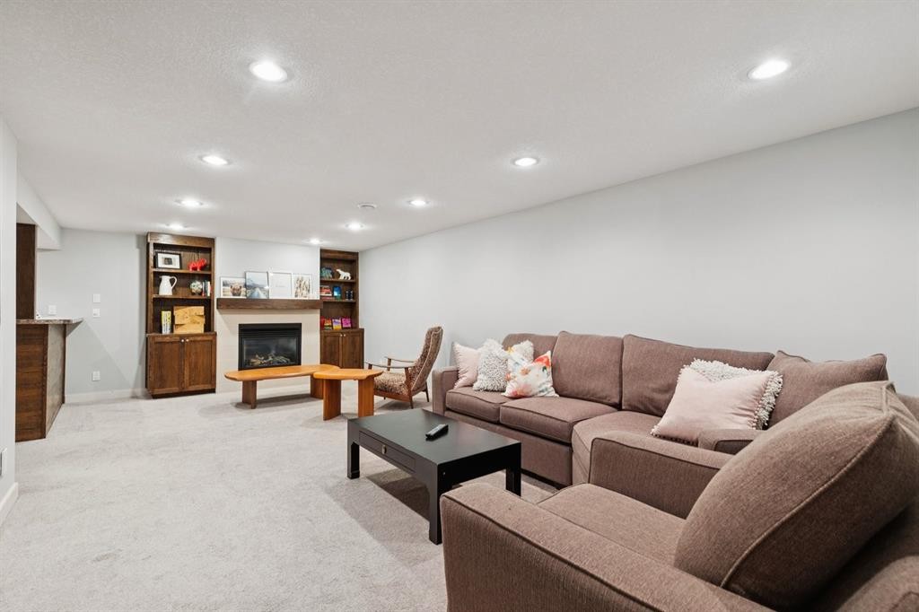716 Cantree Road Sw, Calgary, AB - Indoor With Fireplace