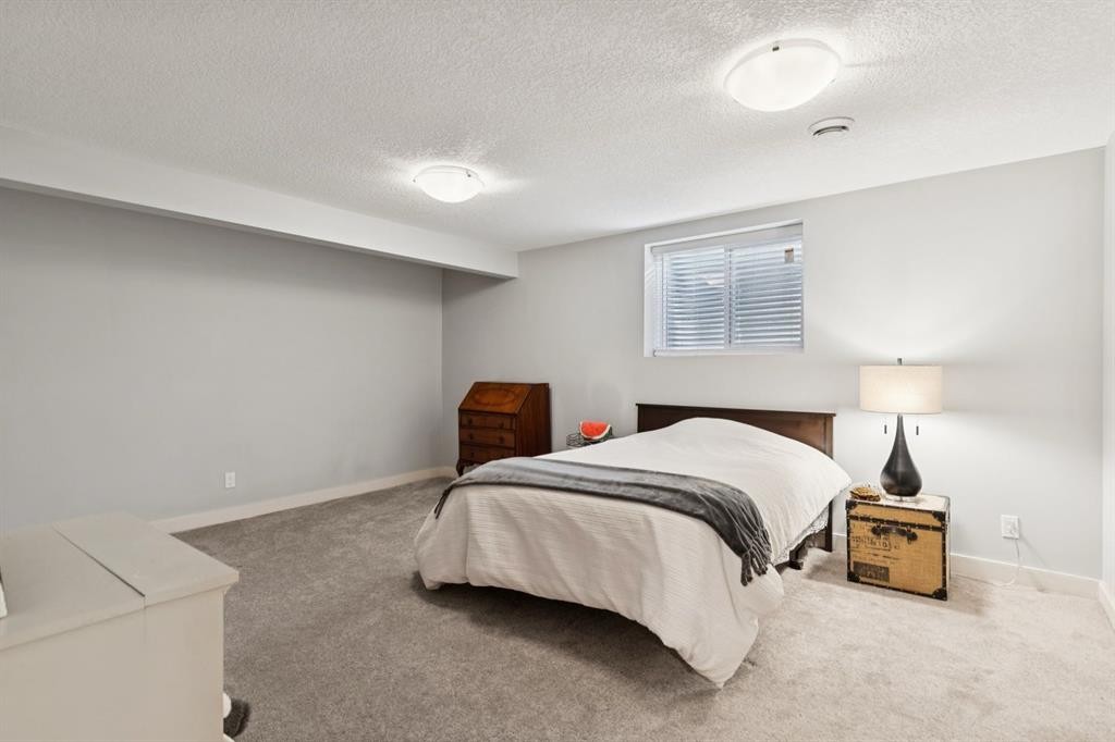 716 Cantree Road Sw, Calgary, AB - Indoor Photo Showing Bedroom