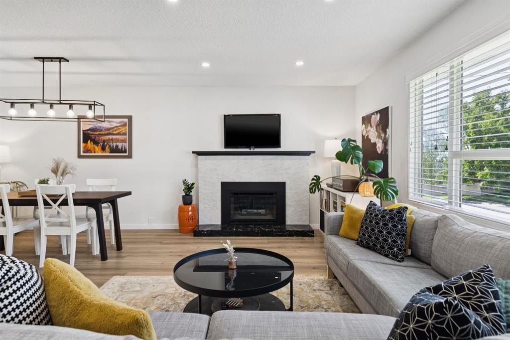 716 Cantree Road Sw, Calgary, AB - Indoor Photo Showing Living Room With Fireplace