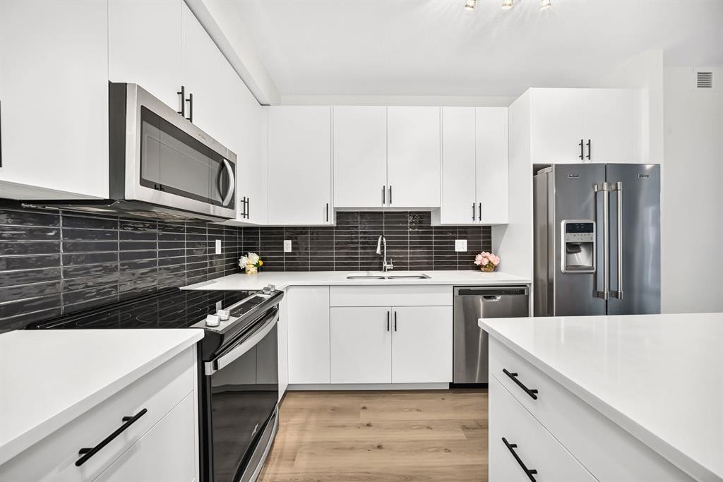 8317-151 Legacy Main Street Se, Calgary, AB - Indoor Photo Showing Kitchen With Stainless Steel Kitchen With Upgraded Kitchen