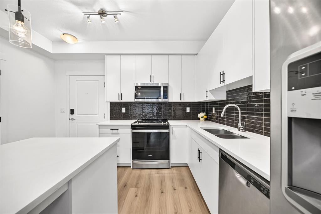 8317-151 Legacy Main Street Se, Calgary, AB - Indoor Photo Showing Kitchen With Stainless Steel Kitchen With Double Sink With Upgraded Kitchen