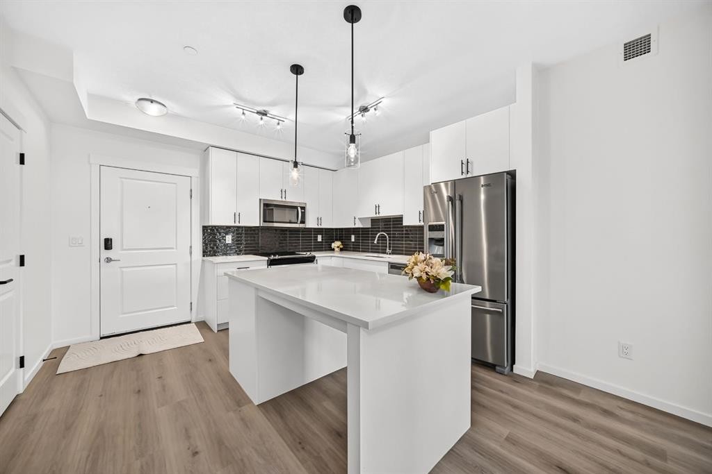 8317-151 Legacy Main Street Se, Calgary, AB - Indoor Photo Showing Kitchen With Stainless Steel Kitchen With Upgraded Kitchen