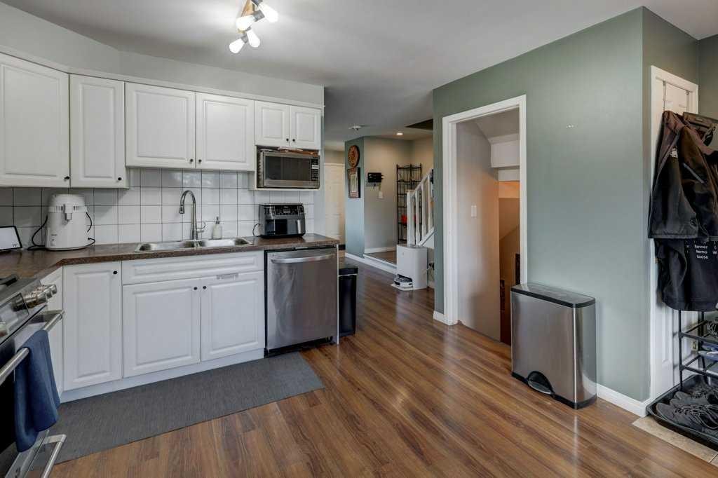 8034 24 Street Se, Calgary, AB - Indoor Photo Showing Kitchen With Stainless Steel Kitchen With Double Sink