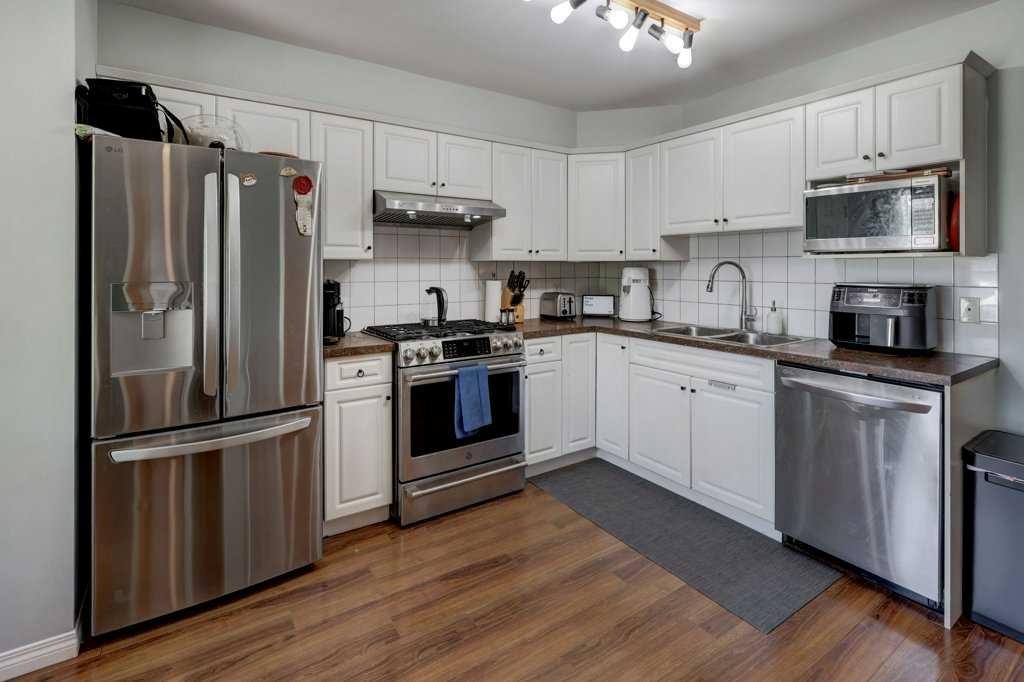 8034 24 Street Se, Calgary, AB - Indoor Photo Showing Kitchen With Stainless Steel Kitchen With Double Sink